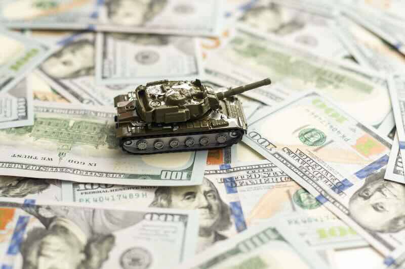 Toy tank on dollar bills