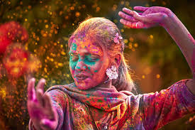 girl covered in colored powder during India's Holi Festival