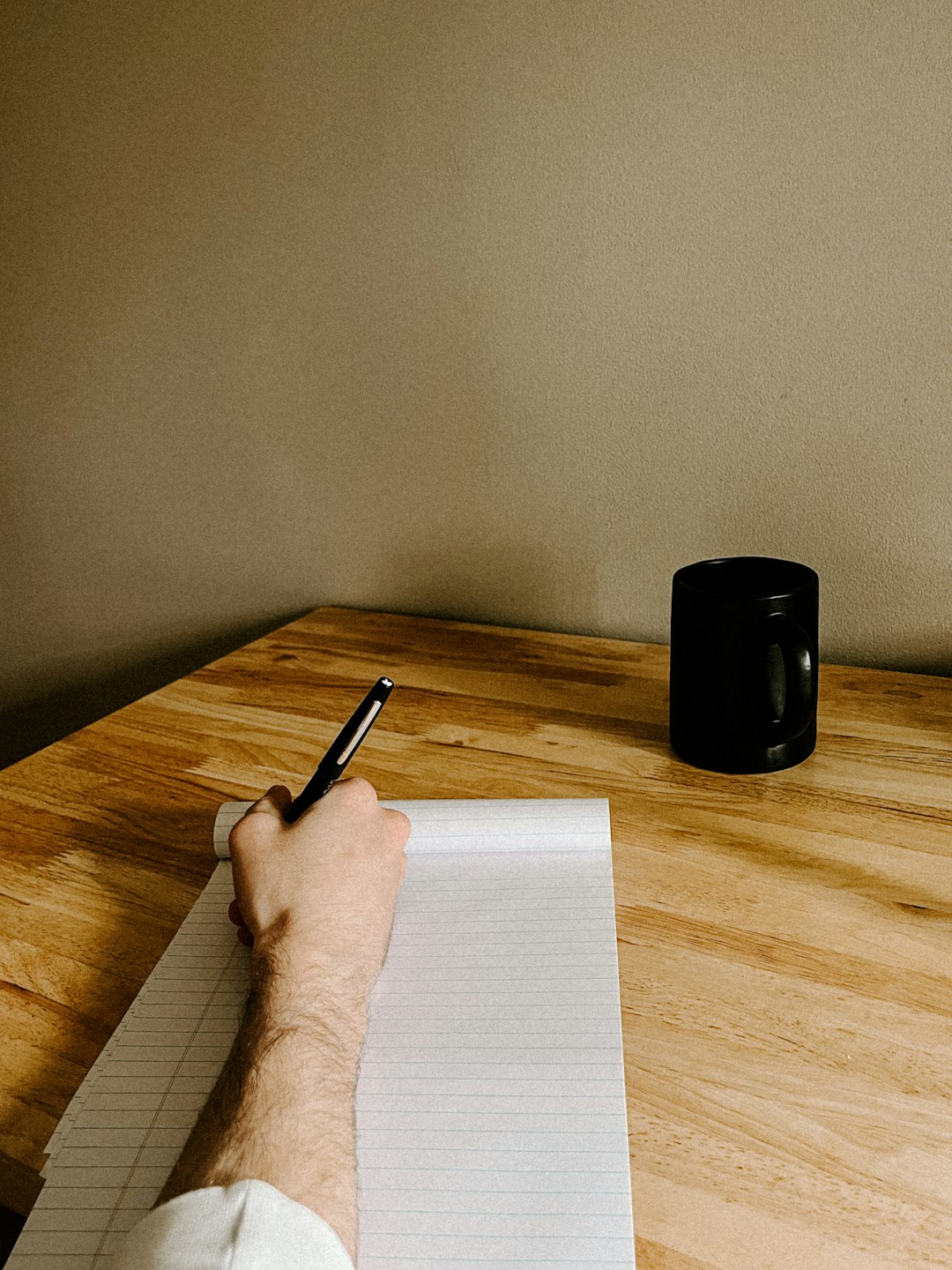 Person practicing 英文寫作 English writing by hand at a desk