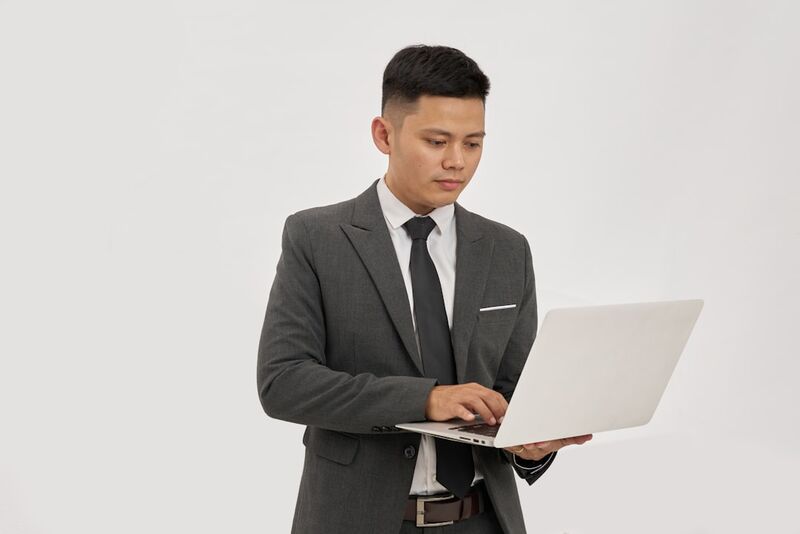 Taiwan office worker using laptop for professional business communication