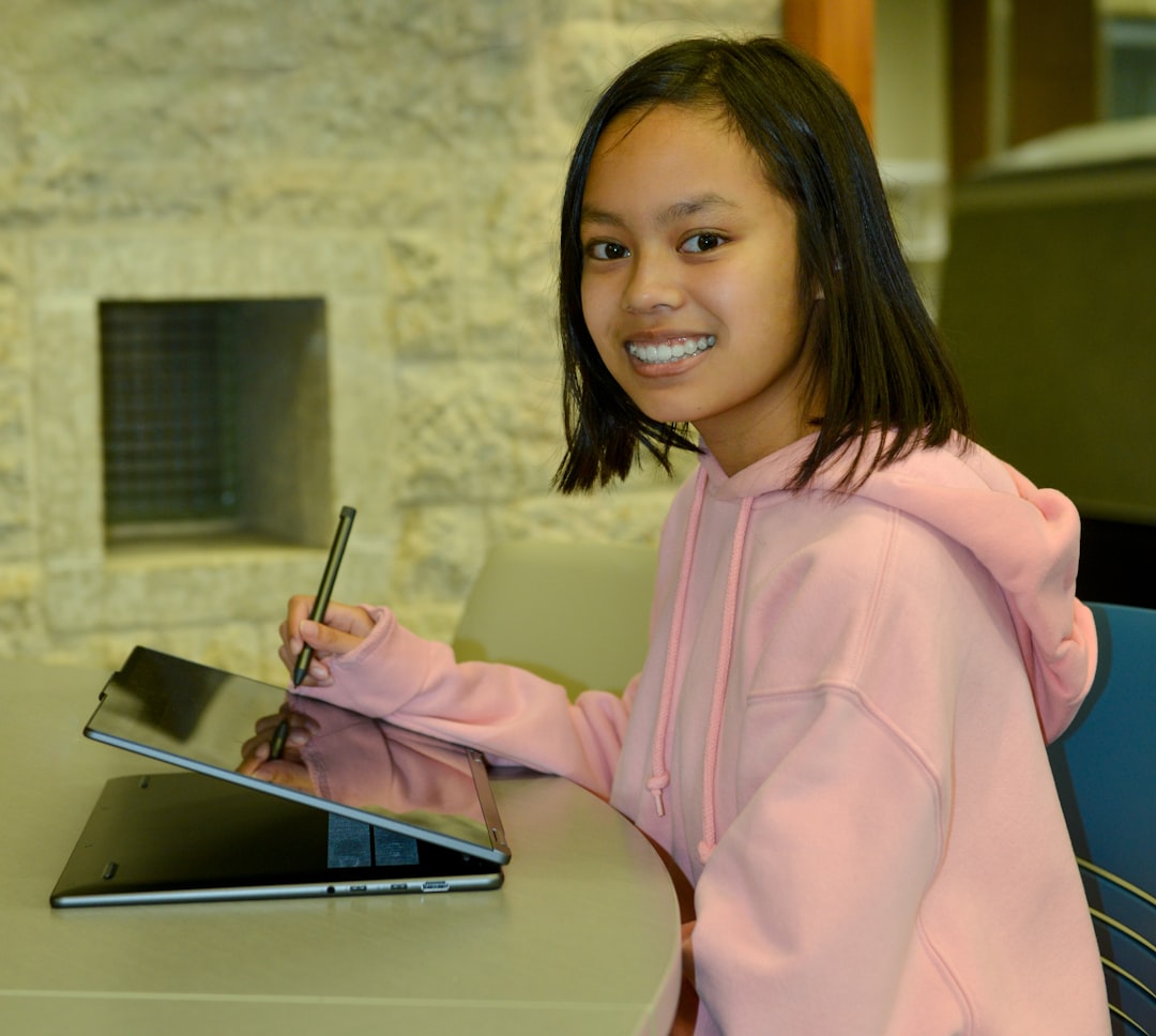 University student studying with laptop and stylus pen