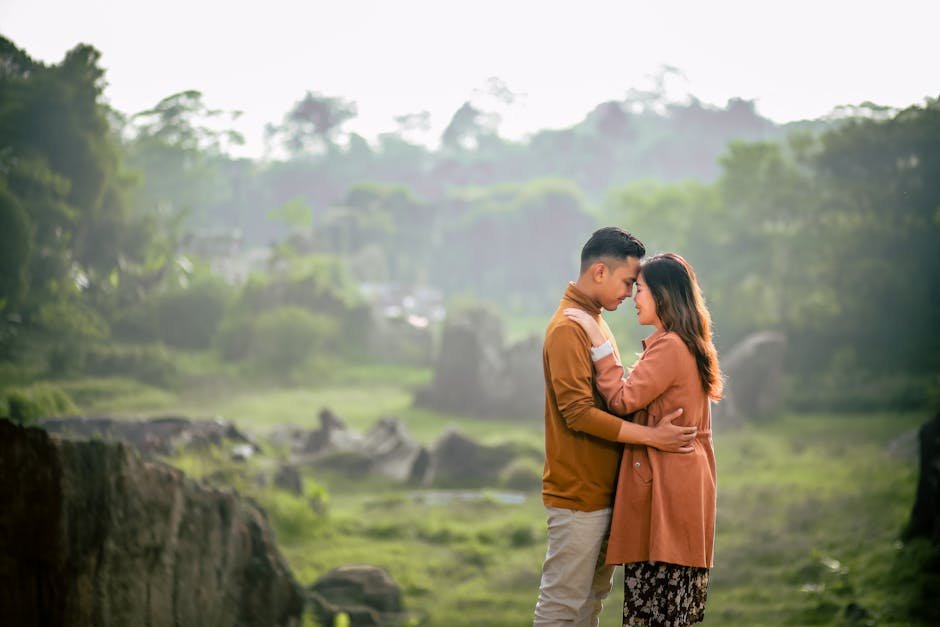 A loving couple shares a romantic moment in a green, serene park during summer. — body parts English idiom