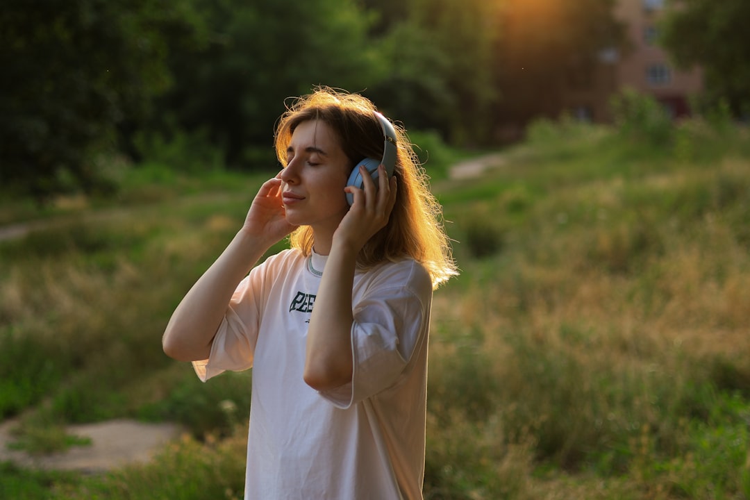 a happy woman listens to music