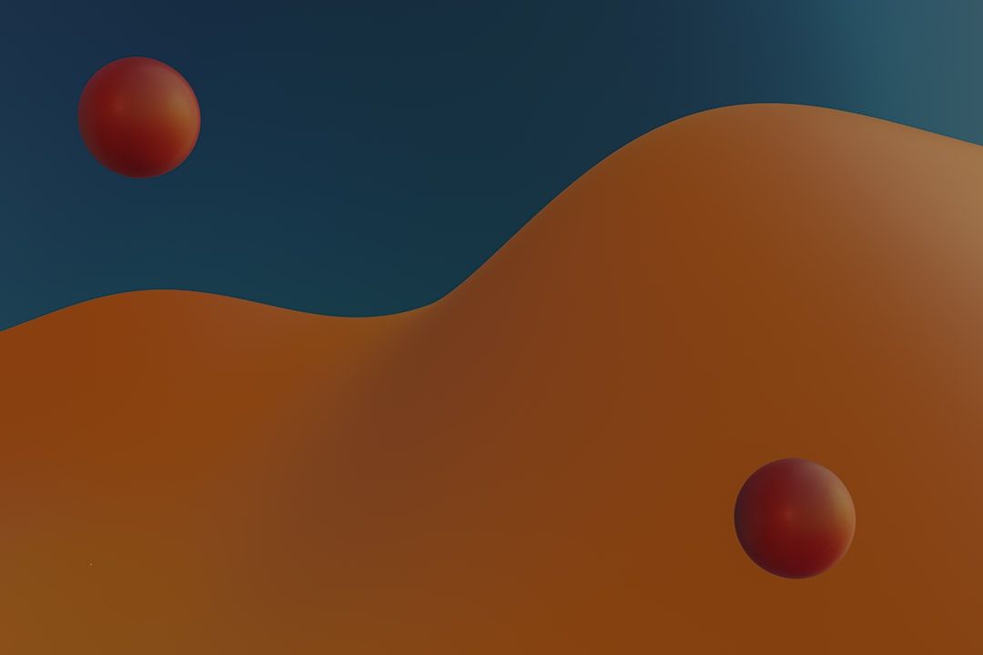 A blurry image of two orange balls in the air