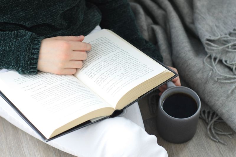 Reading an English novel with morning coffee