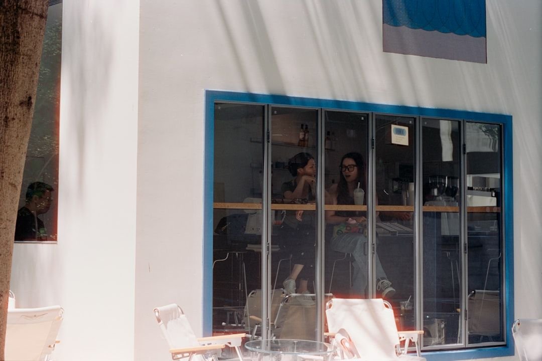 Two friends having a hypothetical English conditional conversation in a Taipei cafe