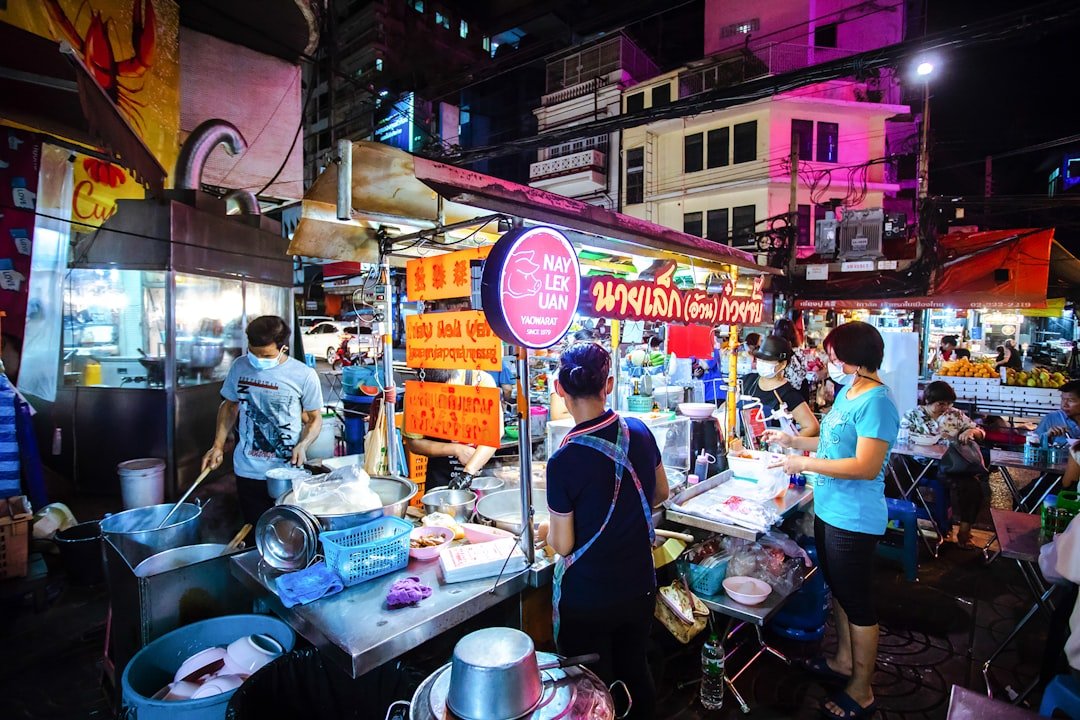 The famed Nay Lek Uan street food stall in Bangkok's Chinatown selling rolled noodle soup with crispy pork.