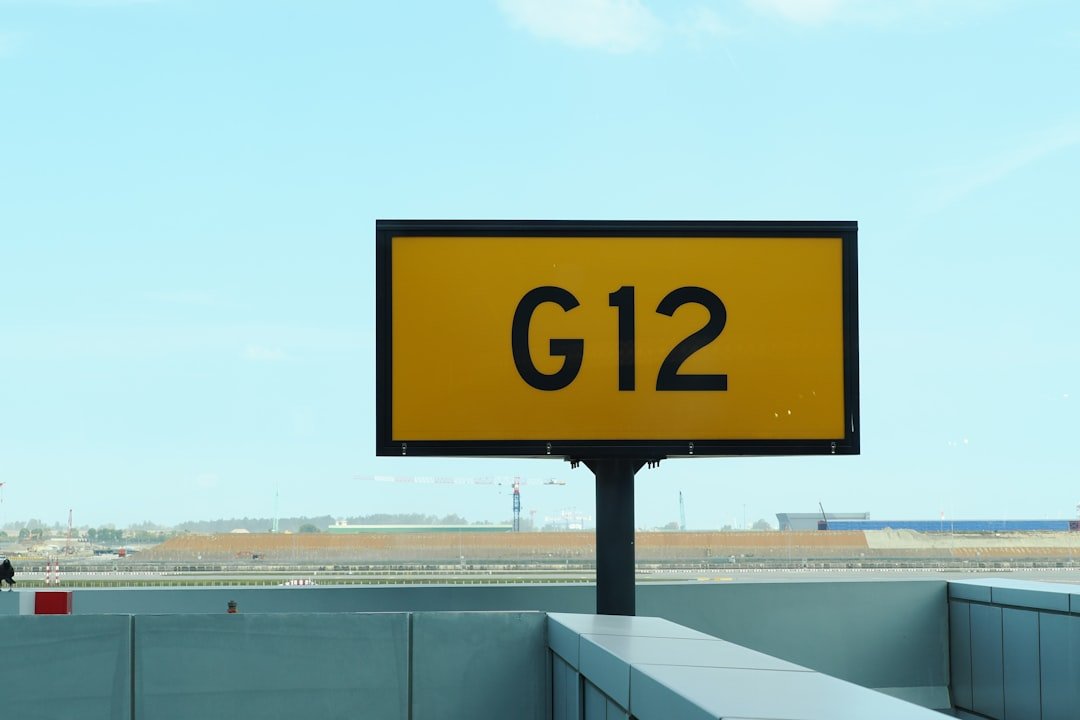 Yellow airport sign with g12 designation