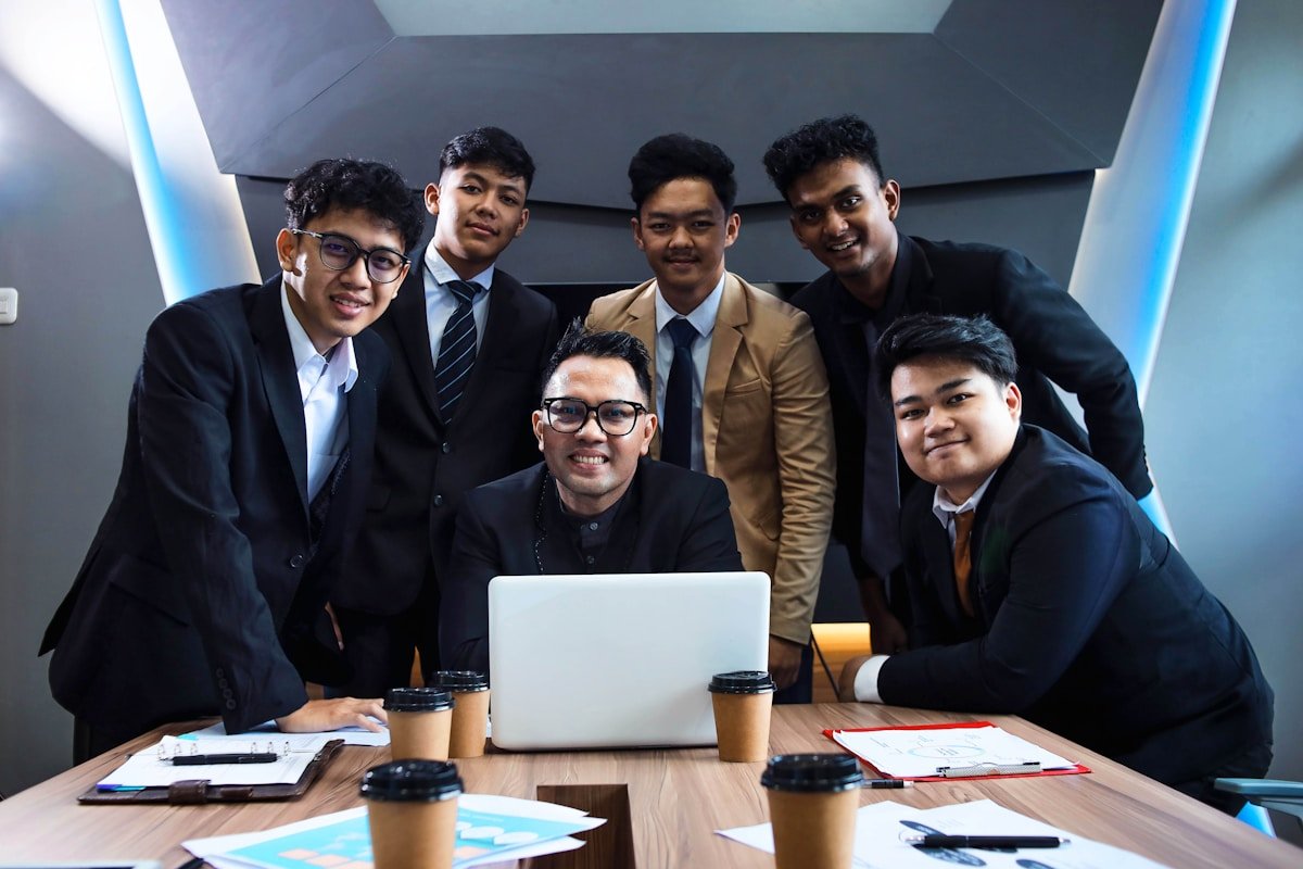 Team meeting using essential workplace English phrases