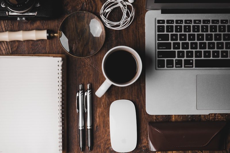 Notebook and coffee for researching smart questions to ask the interviewer