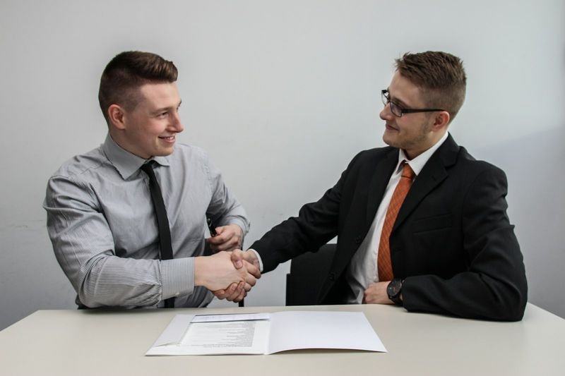 English job offer handshake signing closing interview