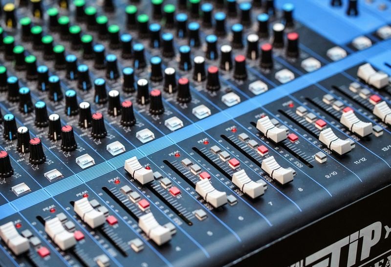 English listening practice resources — an audio mixing console close-up