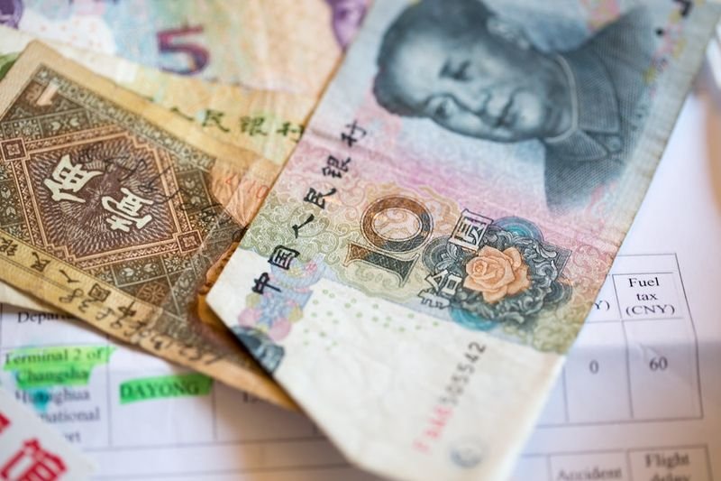 Asian currency banknotes representing 英文數字 for money and NT dollar amounts