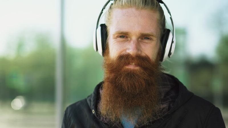 Learning English with songs — a man wearing headphones outdoors