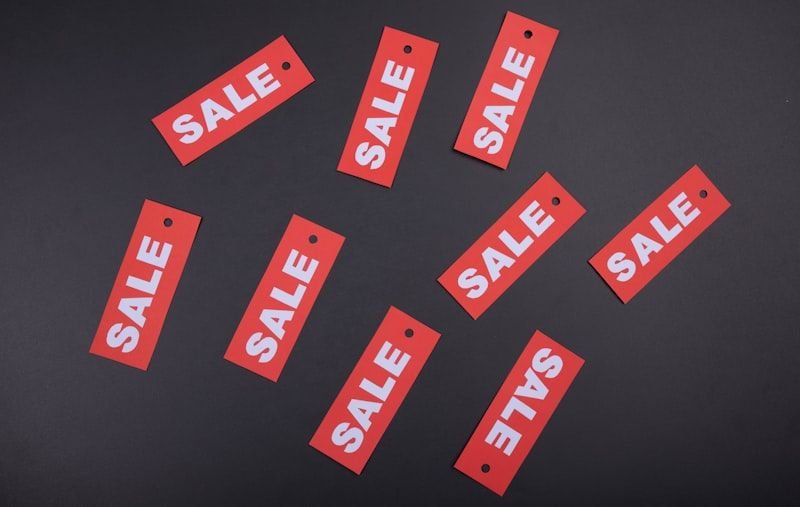 Red SALE price tags illustrating how to say money and prices in English