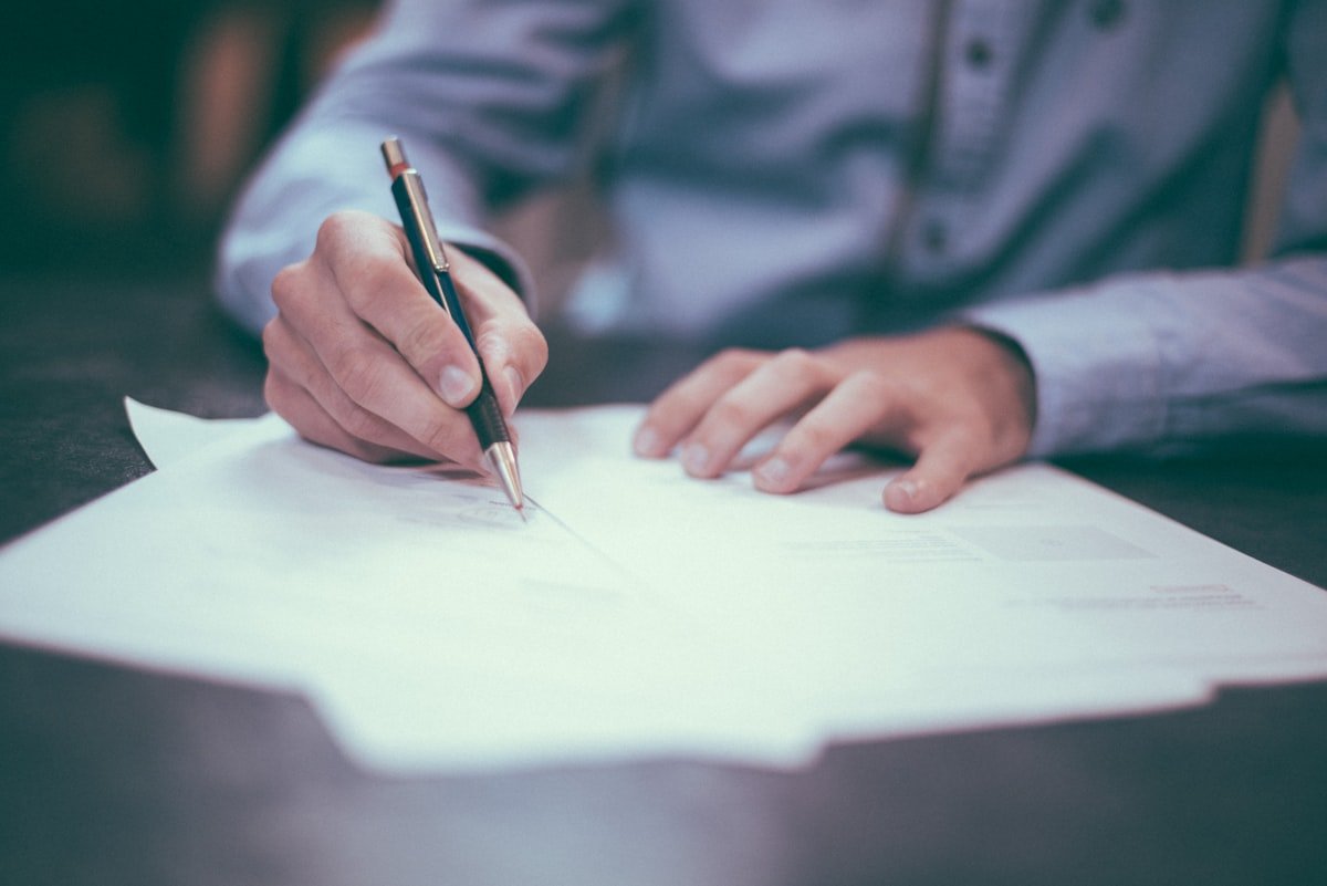 Negotiation English agreement signing document on table