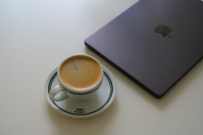 Work from home WFH coffee and laptop morning setup