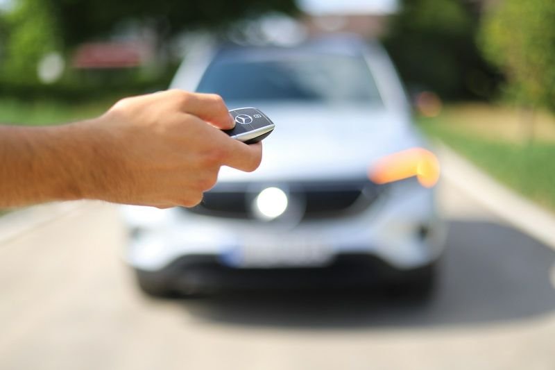 Handing over car keys to show borrow vs lend, two confusing English verbs