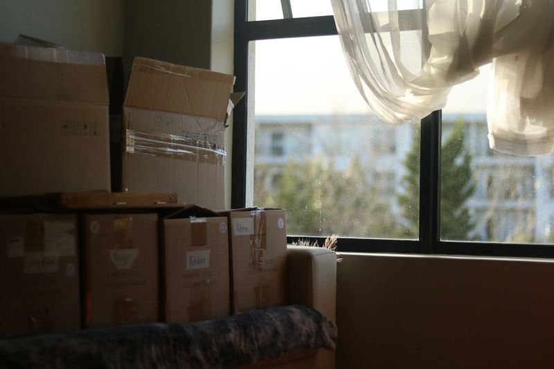 Moving boxes showing bring vs take direction in English