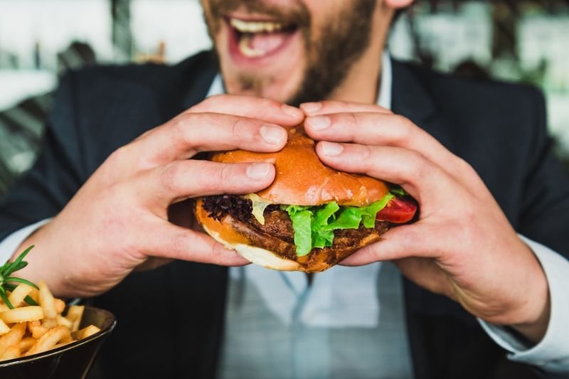 Professional in a suit dining out, using restaurant and dining English on a business trip