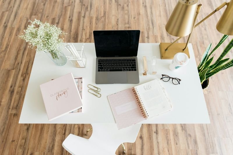 English grammar study desk with planner and laptop
