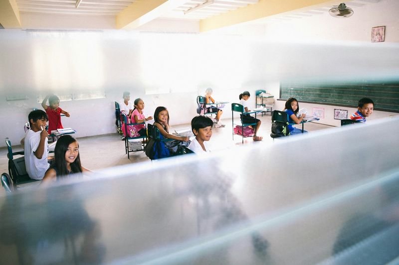 Teenagers doing a group ESL classroom game activity
