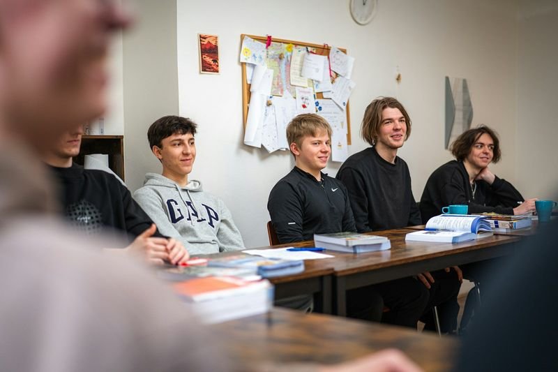 High school students in a circle playing an ESL speaking game