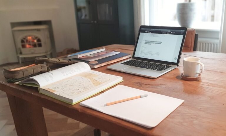 Adjective order in English grammar — study desk with notebook and laptop