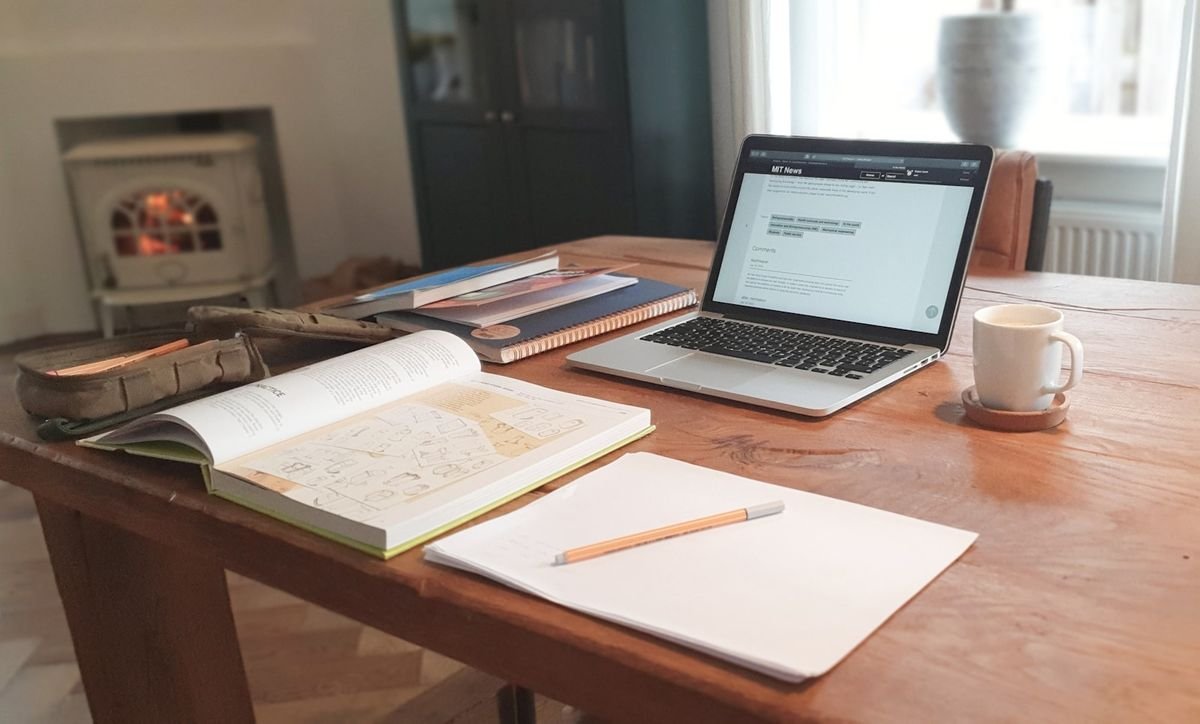 Adjective order in English grammar — study desk with notebook and laptop