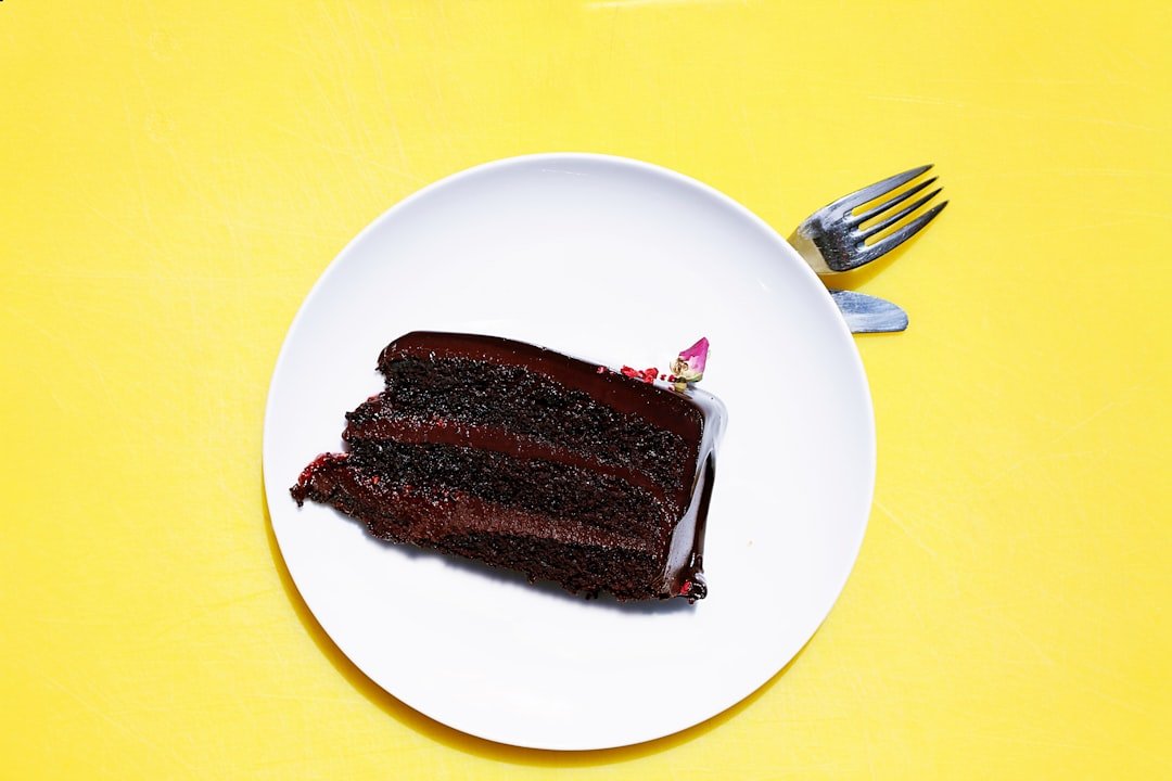 A slice of chocolate cake on a plate &mdash; a piece of cake