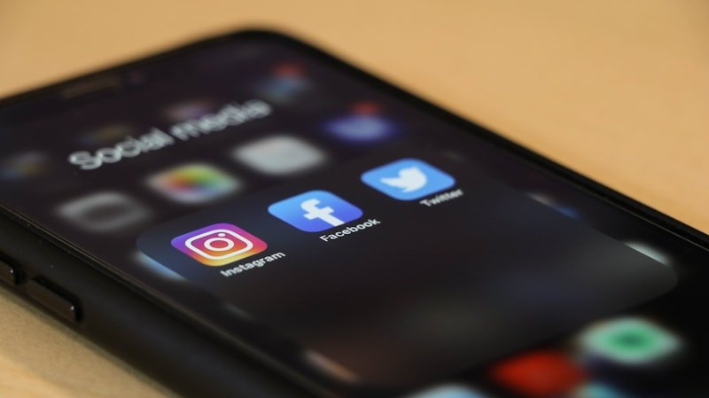 Phone showing social media apps where Gen Z slang spreads