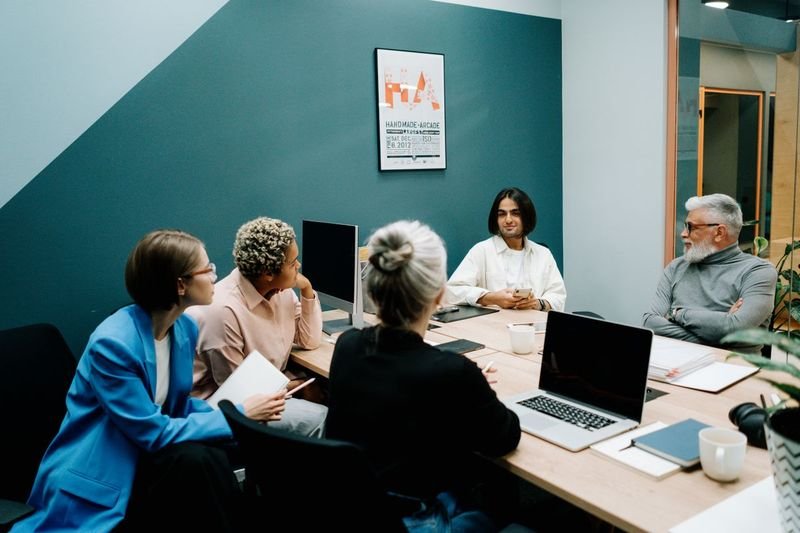 Colleagues giving opinions during an English meeting