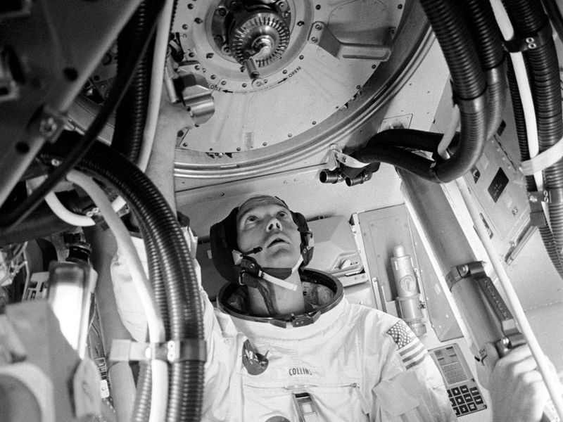 Astronaut Michael Collins in his spacesuit inside the Apollo 11 command module