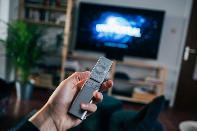 Turning on an English movie with a remote to practice English