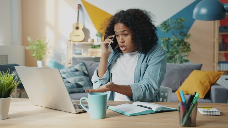 Woman making a complaint call in English on the phone