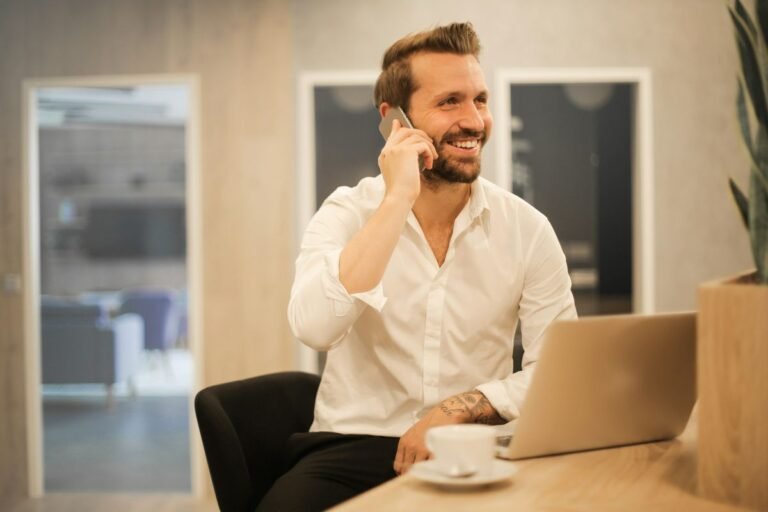 A professional using phone English on a business call in a modern office