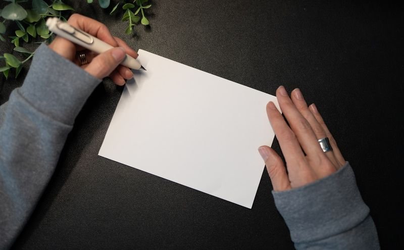 Person writing an English letter using correct punctuation