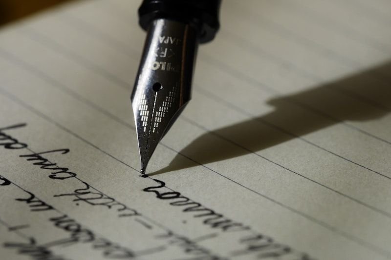 Pen and open notebook for practising English adjective order sentences