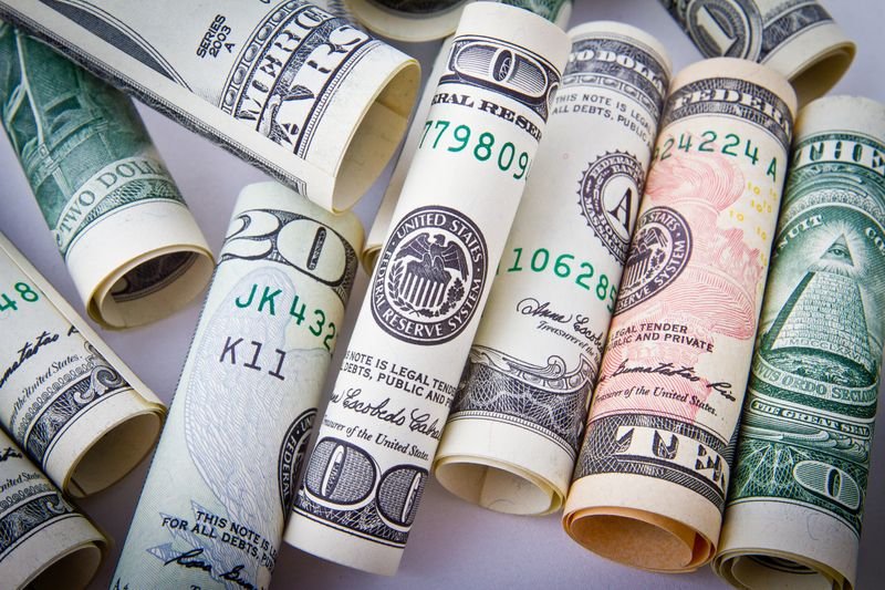 Coins spread out representing money and personal finance idioms