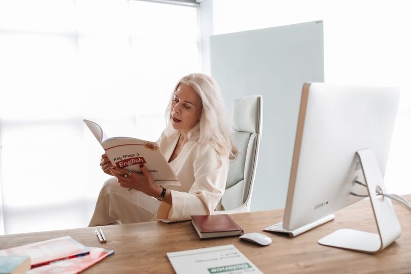 Person studying English grammar at a desk