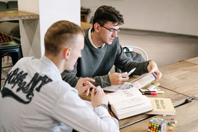 Student studying English phrasal verbs at a desk