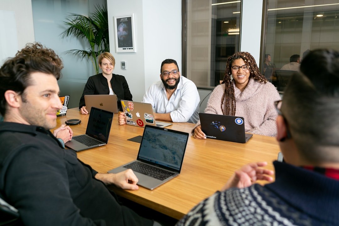 People meeting to discuss app development. Mapbox Uncharted ERG (mapbox.com/diversity-inclusion) created these images to enco