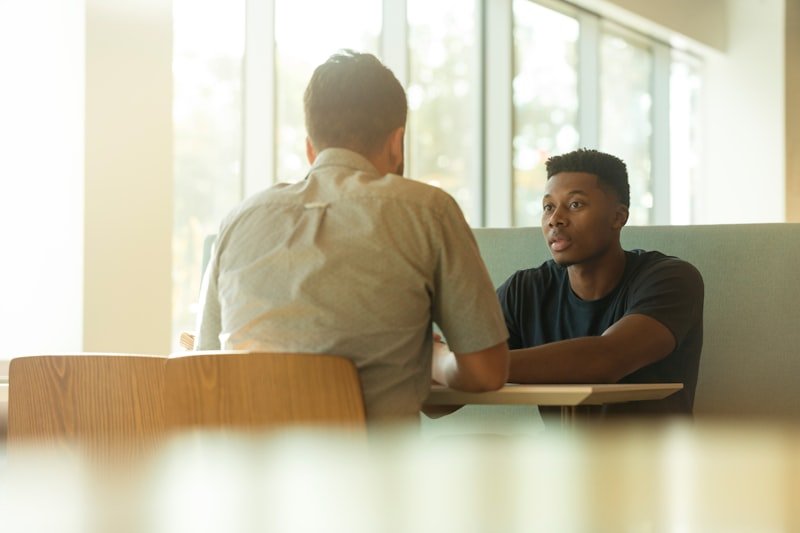 English phrasal verbs make do — two men having a conversation about managing with limited resources