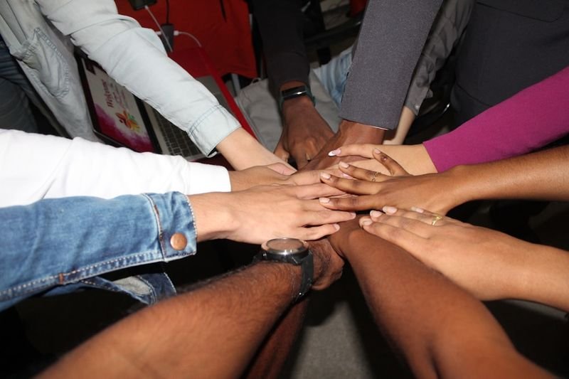 Community volunteers working together — give back meaning English, return or contribute (give back回饋社會)