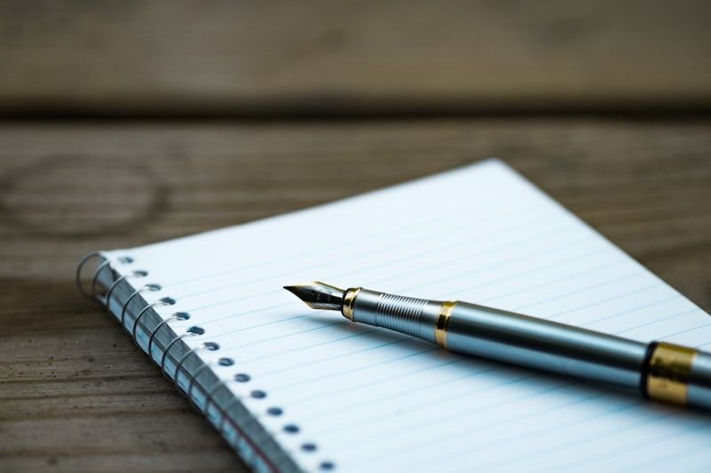 Person handwriting anchor sentences to remember commonly confused English words