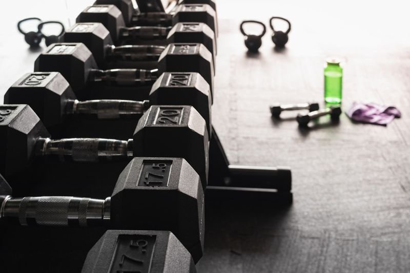 in the pink of health idiom English — person exercising at gym looking healthy