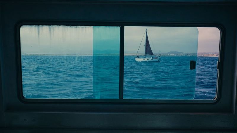 swimmer keeping head above water in ocean English idiom financial survival