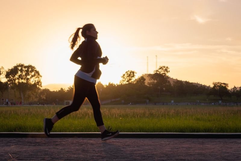 back on your feet health idiom — person jogging outdoors in recovery