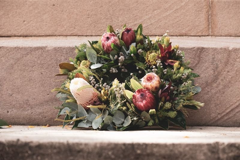 pass away meaning — flowers at a memorial