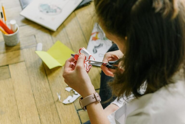 Scissors cutting paper — representing phrasal verbs with CUT in English